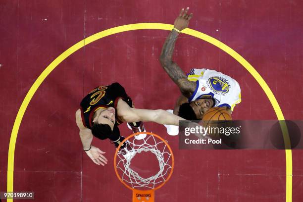 Larry Nance Jr. #22 of the Cleveland Cavaliers and Jordan Bell of the Golden State Warriors compete for the ball in the second half during Game Four...