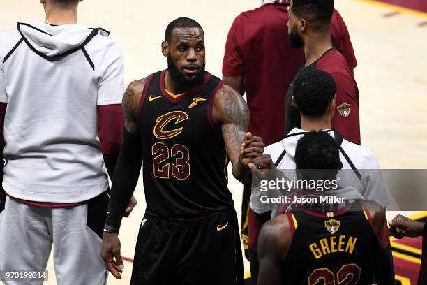 LeBron James of the Cleveland Cavaliers reacts with Jeff Green late in the game against the Golden State Warriors during Game Four of the 2018 NBA...