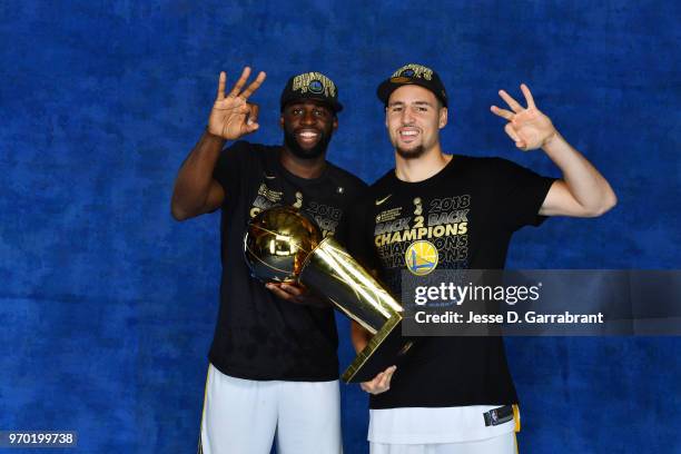 Draymond Green and Klay Thompson of the Golden State Warriors pose for a portrait with the Larry O'Brien Championship trophy after defeating the...