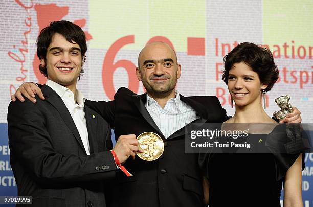 Director Florin Serban holds his Silver Bear Jury Grand Prix Award with actress Ada Condeescu and actor George Pistereanu at the 'Award Winners'...