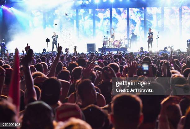 Matt Bellamy, Chris Wolstenholme and Dominic Howard of Muse perform on What Stage during day 2 of the 2018 Bonnaroo Arts And Music Festival on June...