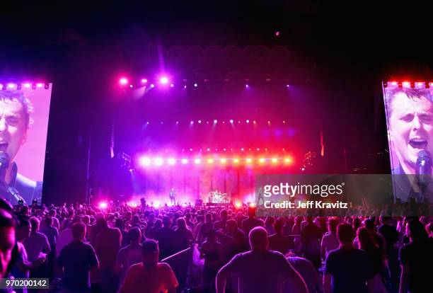 Chris Wolstenholme, Dominic Howard and Matt Bellamy of Muse perform on What Stage during day 2 of the 2018 Bonnaroo Arts And Music Festival on June...