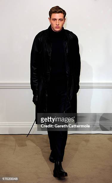 Model walks the catwalk during the Gieves & Hawkes Fashion Show at 14 Savile Row as part of London Fashion Week on February 24, 2010 in London,...