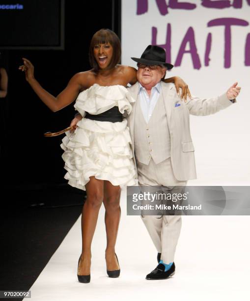 Alexandra Burke and Ronnie Corbett walk the runway at the Fashion for Relief show for London Fashion Week Autumn/Winter 2010 at Somerset House on...