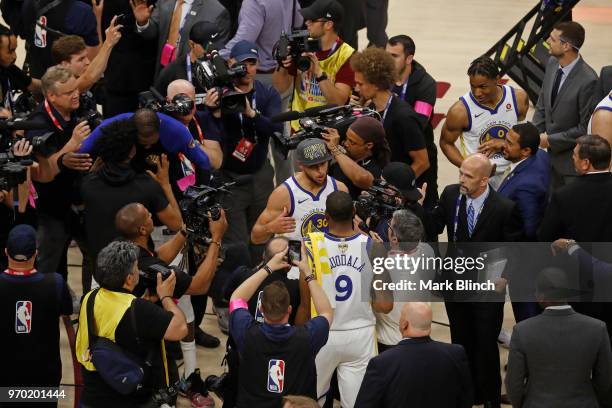 Andre Iguodala and Stephen Curry of the Golden State Warriors celebrate on court after winning Game Four of the 2018 NBA Finals against the Cleveland...