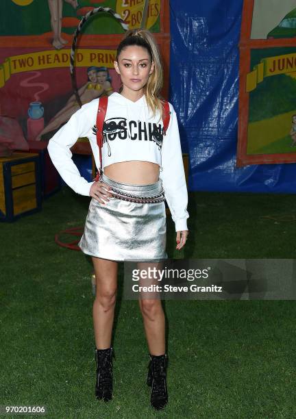 Caroline D'Amore arrives at the Moschino Spring/Summer 19 Menswear And Women's Resort Collection at Los Angeles Equestrian Center on June 8, 2018 in...