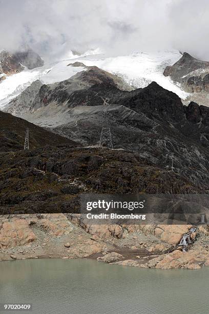 Water levels remain low in a Zongo Valley reservoir that is fed by runoff from the Huayna Potosi glacier and powers Cia Boliviana de Energia Eleca SA...