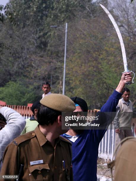 Members of the Sikh community protest against Congress leader Sajjan Kumar in New Delhi on February 23, 2010.