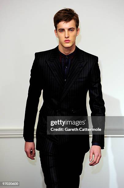 Model walks down the catwalk during the Gieves & Hawkes Fashion Show at 14 Savile Row as part of London Fashion Week on February 24, 2010 in London,...