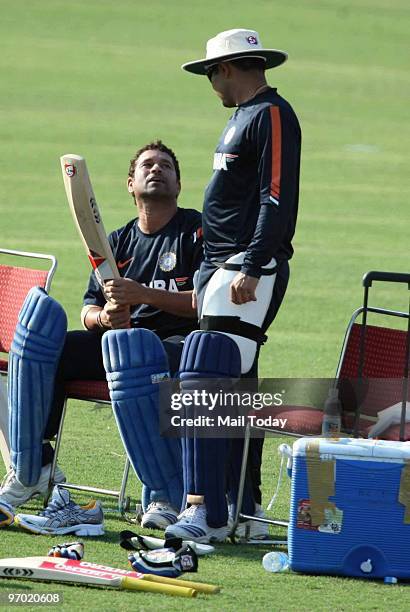 Sachin Tendulkar has a word with Virender Sehwag during the practice session in Gwalior on February 23, 2010.