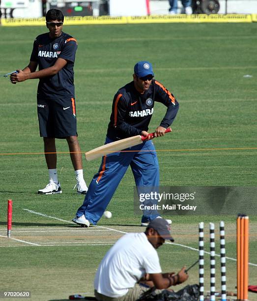 Captain Mahendra Singh Dhoni and Ashish Nehra during the practice session in Gwalior on February 23, 2010.