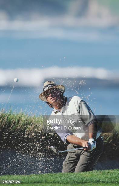 Blaine McCallister of the United States plays out of a bunker during the AT&T Pebble Beach Pro-Am golf tournament on 3 February 1995 at the Pebble...