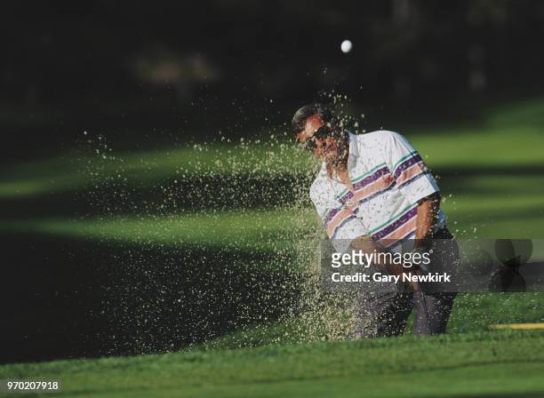 Fuzzy Zoeller of the United States plays out of a bunker during the AT&T Pebble Beach Pro-Am golf tournament on 5 February 1995 at the Pebble Beach...