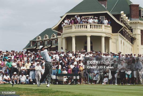Tiger Woods of the United States drives off the tee in front of the club house and watching spectators during the United States Amateur Championship...