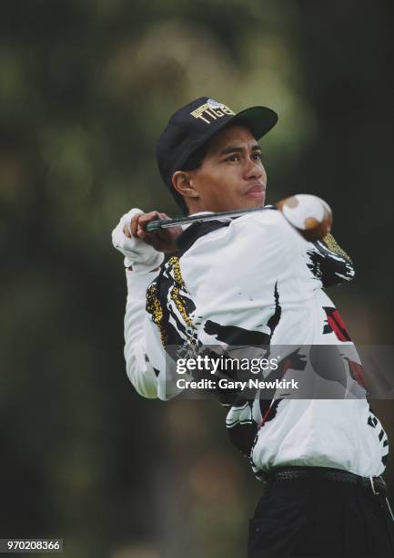 Tiger Woods of the United States drives off the tee during the Nissan Los Angeles Open golf tournament on 26 February 1995 at the Riviera Country...