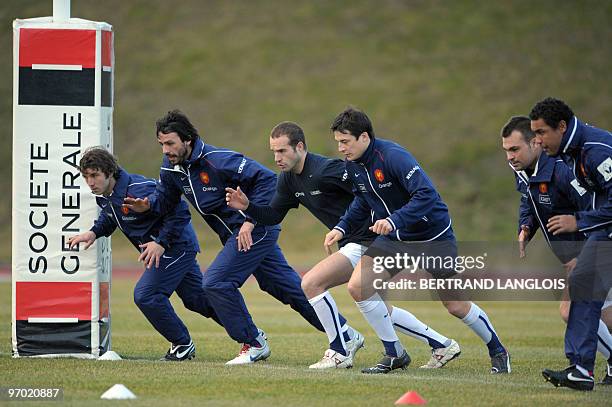 French rugby national team's winger Marc Andreu, fullback Clement Poitrenaud, scrum-half Frederic Michalak, fly-half francois Trinh-Duc, prop Nicolas...