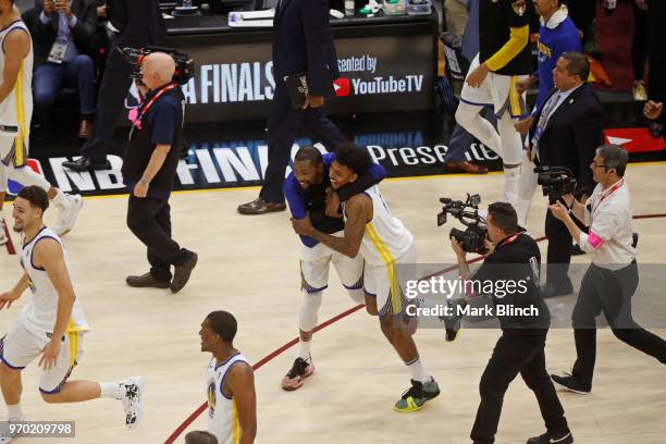 Kevin Durant and Nick Young of the Golden State Warriors celebrate on court after winning Game Four of the 2018 NBA Finals against the Cleveland...