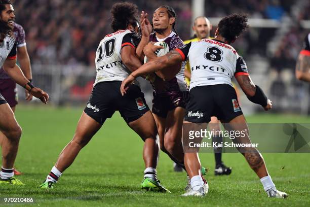 Martin Taupau of the Sea Eagles is tackled during the round 14 NRL match between the Manly Sea Eagles and the New Zealand Warriors at AMI Stadium on...