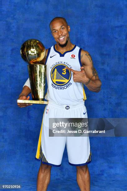 David West of the Golden State Warriors poses for a portrait with the Larry O'Brien Championship trophy after defeating the Cleveland Cavaliers in...