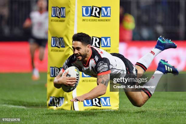 Shaun Johnson of the Warriors dives over to score a try during the round 14 NRL match between the Manly Sea Eagles and the New Zealand Warriors at...