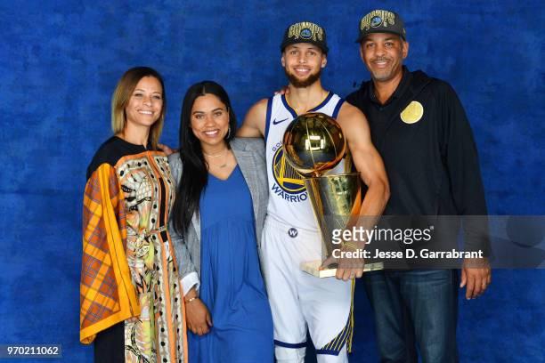 Stephen Curry of the Golden State Warriors and his family pose for a portrait with the Larry O'Brien Championship trophy after defeating the...