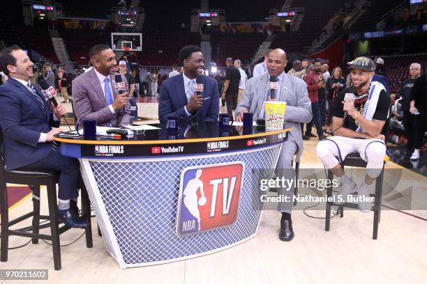 Casey Stern, Grant Hill, Chris Webber, and Charles Barkley speak to Stephen Curry of the Golden State Warriors after Game Four of the 2018 NBA Finals...