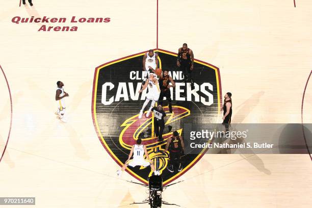 JaVale McGee of the Golden State Warriors and Tristan Thompson of the Cleveland Cavaliers jump for the opening tip-off in Game Four of the 2018 NBA...