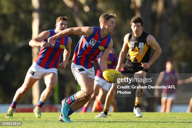 Eli Templeton of Port Melbourne handballs during the round 10 VFL match between Werribee and Port Melbourne at Avalon Airport Oval on June 9, 2018 in...