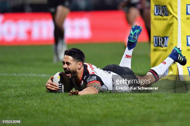 Shaun Johnson of the Warriors dives over to score a try during the round 14 NRL match between the Manly Sea Eagles and the New Zealand Warriors at...
