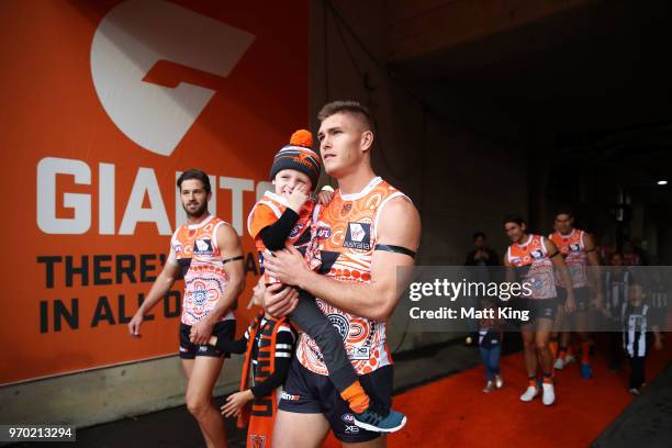 Adam Tomlinson of the Giants walks through the race during the round 12 AFL match between the Greater Western Sydney Giants and the Gold Coast Suns...