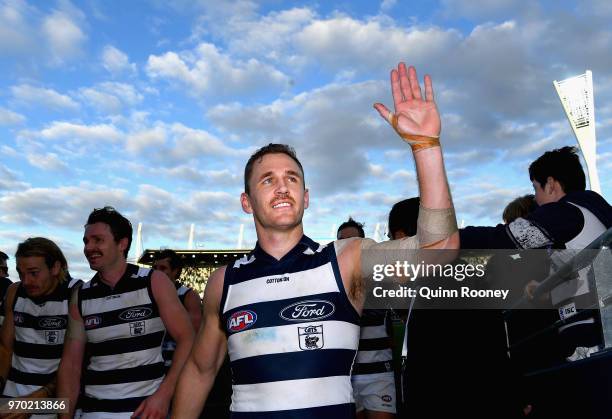 Joel Selwood of the Cats high fives fans after winning the round 12 AFL match between the Geelong Cats and the North Melbourne Kangaroos at GMHBA...