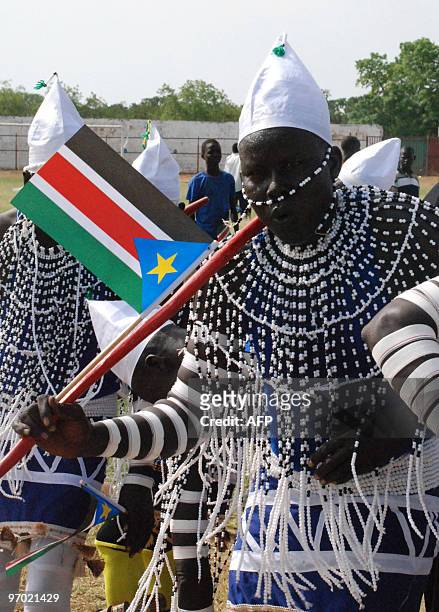 Southern Sudanese traditional dancer waves his flag during a rally for the Sudan Peoples� Liberation Movement in Juba, the capital of semi-autonomous...