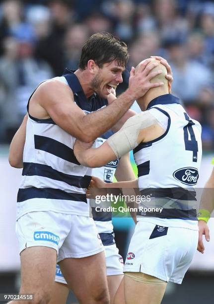 Tom Hawkins and Gary Ablett of the Cats celebrate a goal during the round 12 AFL match between the Geelong Cats and the North Melbourne Kangaroos at...