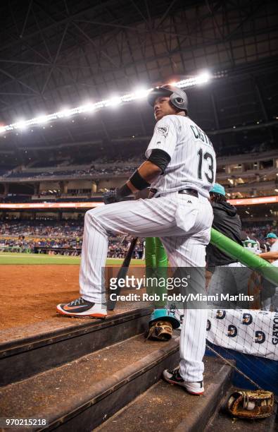Starlin Castro of the Miami Marlins looks on from the dugout during the fourth inning of the game against the San Diego Padres at Marlins Park on...