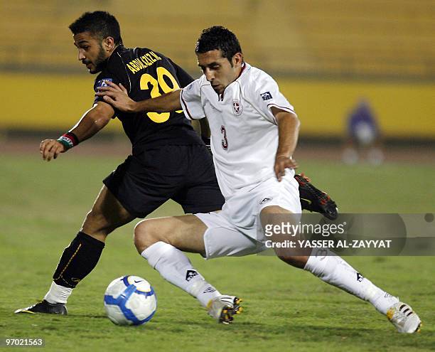 Abdulaziz al-Enezi of Kuwaits Al-Qadsia vies with Hussein Nassrallah of Lebanese Al-Nejmeh club during their AFC Cup football match in Kuwait City on...