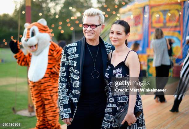 Billy Idol and China Chow attend the Moschino Spring/Summer 19 Menswear and Women's Resort Collection at Los Angeles Equestrian Center on June 8,...