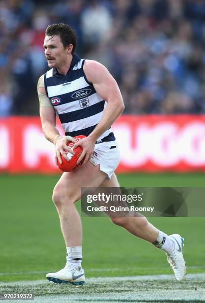 Patrick Dangerfield of the Cats kicks during the round 12 AFL match between the Geelong Cats and the North Melbourne Kangaroos at GMHBA Stadium on...