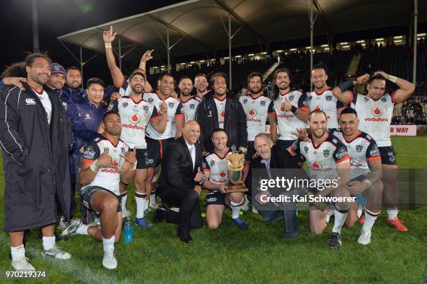 Blake Green of the Warriors and his team mates pose with the Broadhurst-Shelford Trophy after their win in the round 14 NRL match between the Manly...