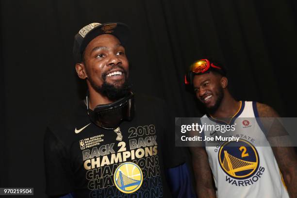 Jordan Bell of the Golden State Warriors and Kevin Durant of the Golden State Warriors talk during post-game portraits after Game Four of the 2018...