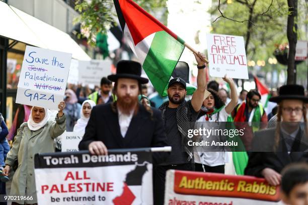 Protesters including members of Orthodox Jews gather in front of the Israeli consulate general to demonstrate against Israeli violence against...