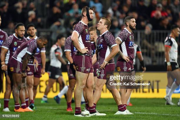 Shaun Lane of the Sea Eagles and his team mates look dejected after conceding a try during the round 14 NRL match between the Manly Sea Eagles and...
