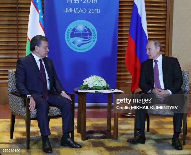 Russian President Vladimir Putin meets with his Uzbek counterpart Shavkat Mirziyoyev on the sidelines of the Shanghai Cooperation Organisation Summit...
