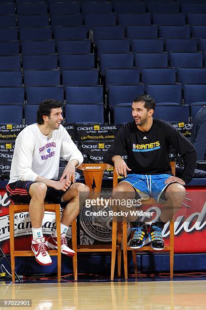 Vladimir Radmanovic of the Golden State Warriors and Peja Stojakovic of the New Orleans Hornets talk during warm-ups prior to their game at Oracle...