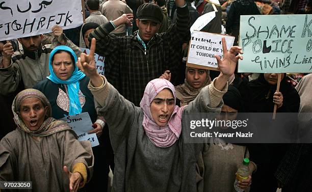 Neighbors and relatives of Wamiq Farooq, a 13-year-old teenager who was killed by a teargas shell fired by Indian police last month, shout slogans...