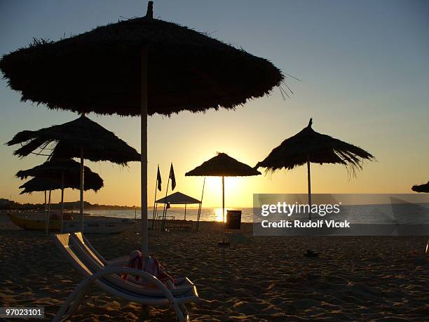 small hours sunshades - hammamet beach stock pictures, royalty-free photos & images