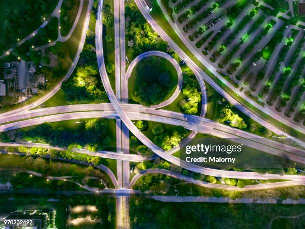 city of the future at night. top view, view from above, aerial view - auto licht stock-fotos und bilder