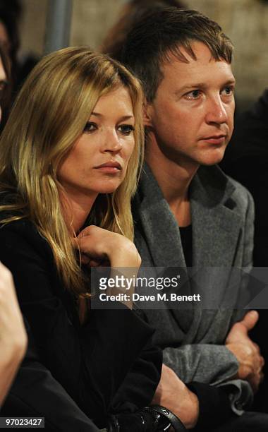 Kate Moss and Jefferson Hack watch the the James Small a/w 2010 London Fashion Week show, at Somerset House on February 24, 2010 in London, England.