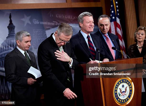 Senator Jack Reed , Senate Majority Leader Harry Reid , Senator Charles Schumer and Senator Barbara Boxer listen as Senator Max Baucus speaks during...