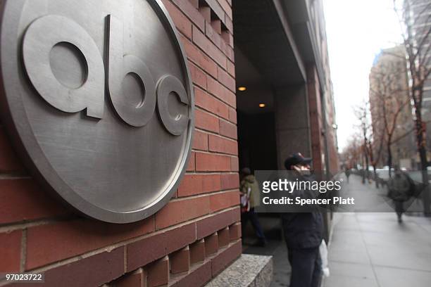People stand outside of the ABC headquarters on February 24, 2010 in New York, New York. ABC has announced that the television news division plans to...