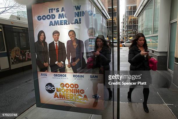 Woman walks by a sign advertising ABC news outside of ABC headquarters on February 24, 2010 in New York, New York. ABC has announced that the...
